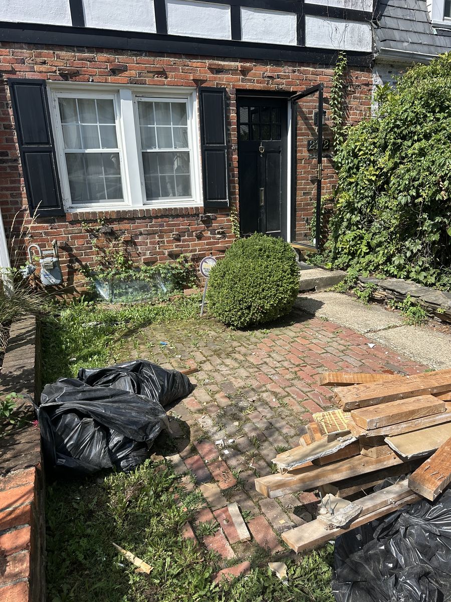 After — cleared entryway at Arlington townhouse, appliances removed
