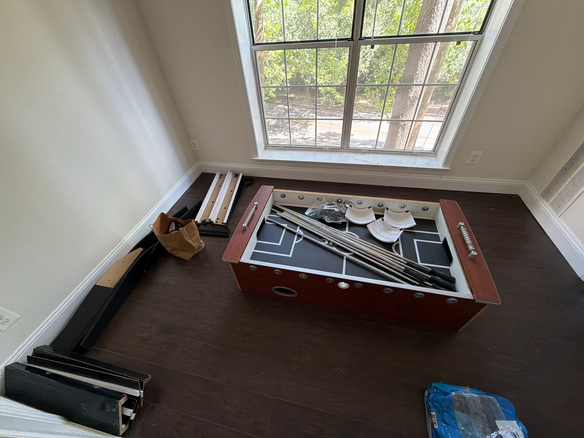 Foosball table legs and hardware bagged for reassembly — Arlington VA donation pickup