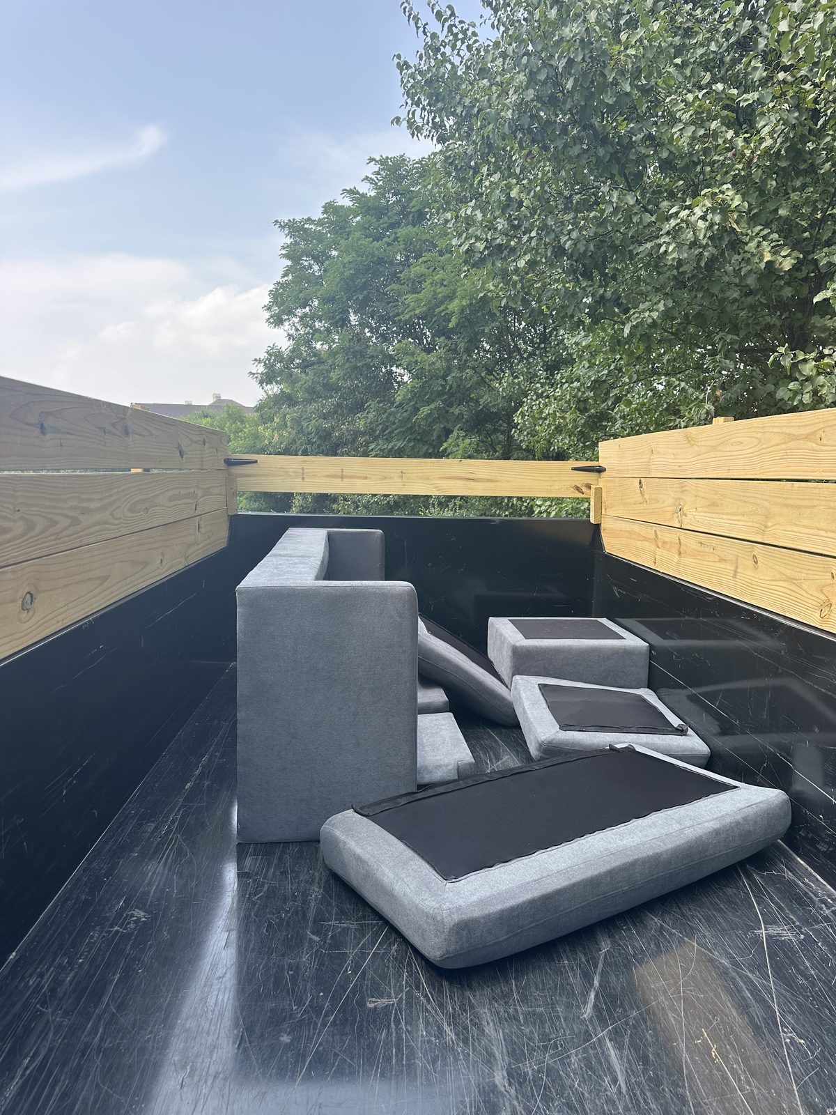 Old sectional sofa loaded on trailer — Arlington, VA sofa removal — DMV Go Junk