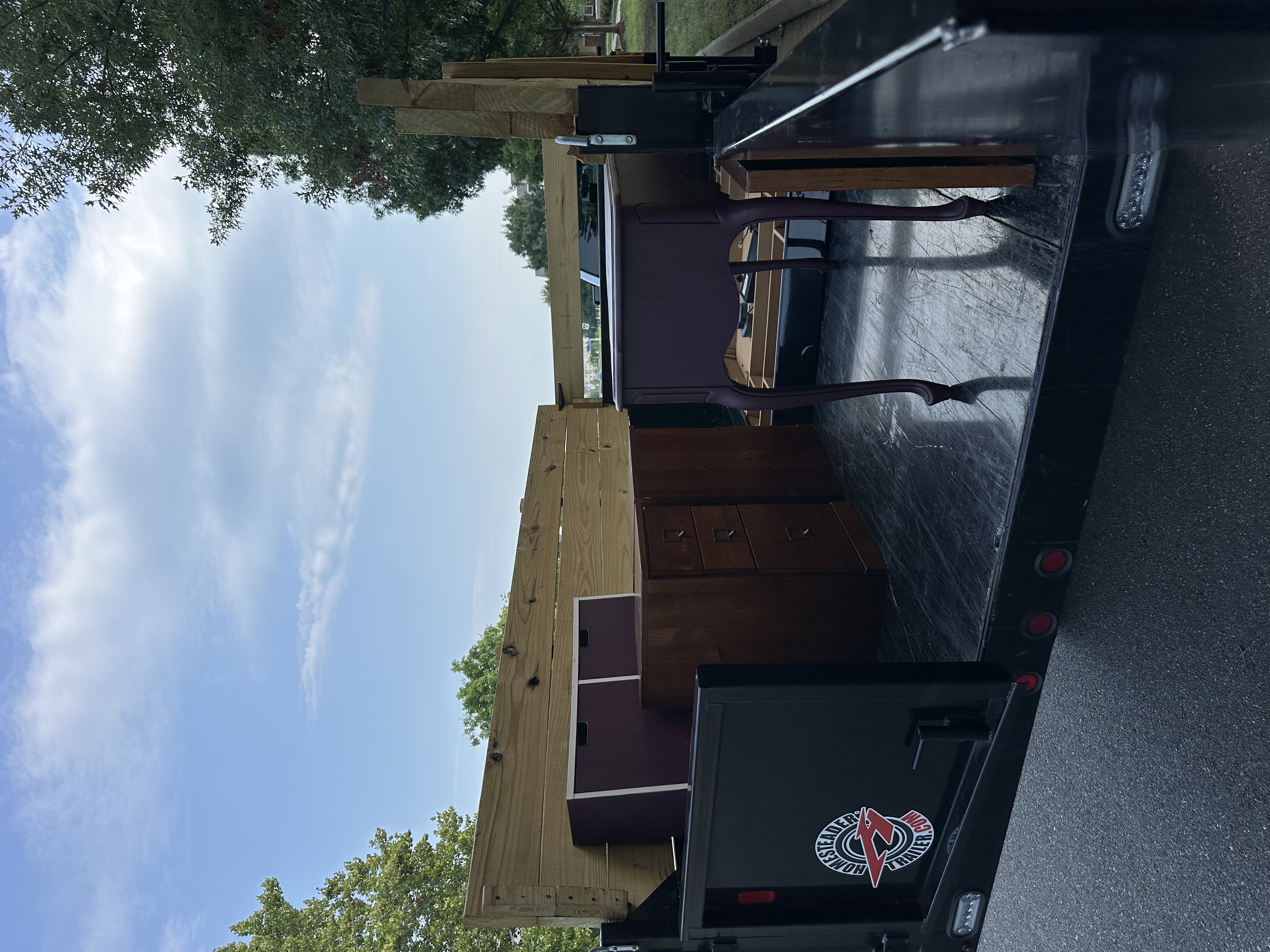 Trailer loaded with donated furniture — file cabinets and side table, Ashburn VA