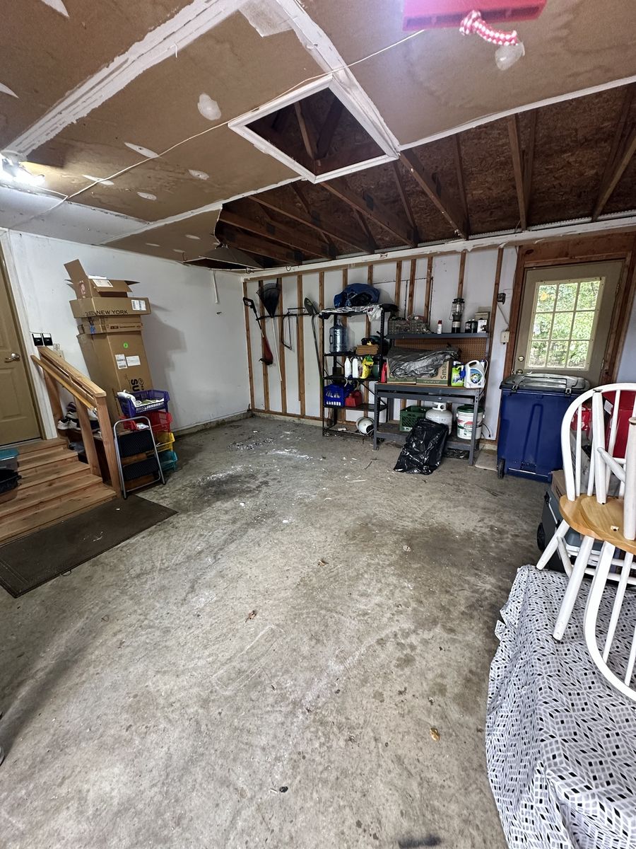 Same garage after cleanout, floor cleared and swept — Chantilly, VA