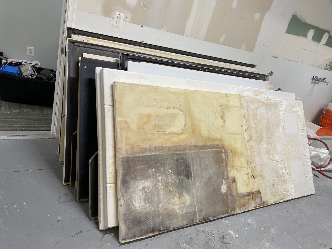 Cabinet panels stacked — Chantilly VA commercial removal