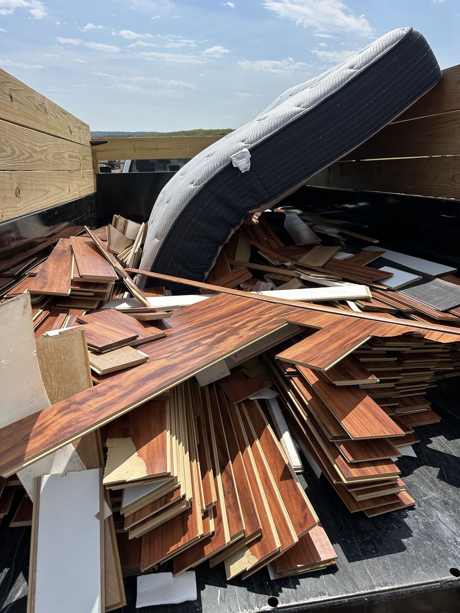 Truck loaded with removed flooring debris