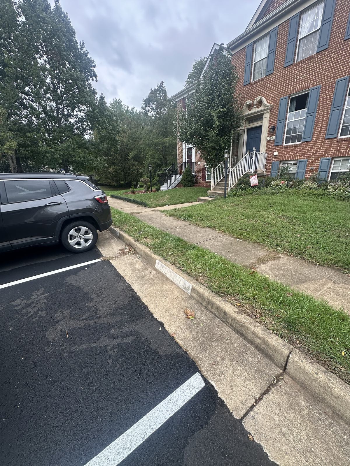 Sterling townhouse street after furniture removal, curb cleared
