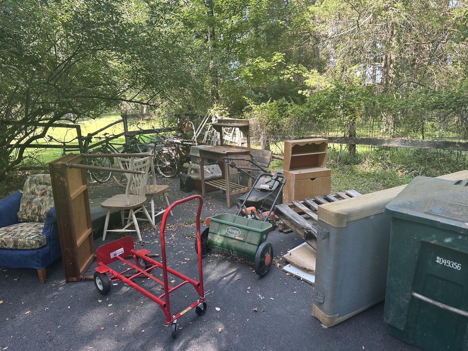 Full driveway of junk before cleanout — Great Falls, VA