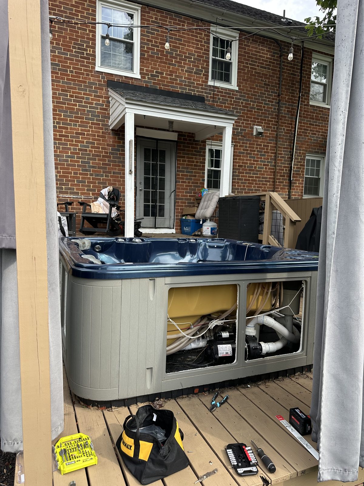 Hot tub before removal, panel open — DMV Go Junk
