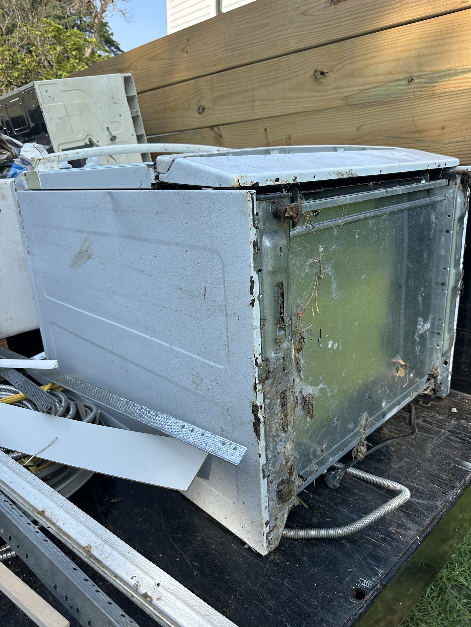 Old appliance loaded on trailer for haul-away — Leesburg, VA