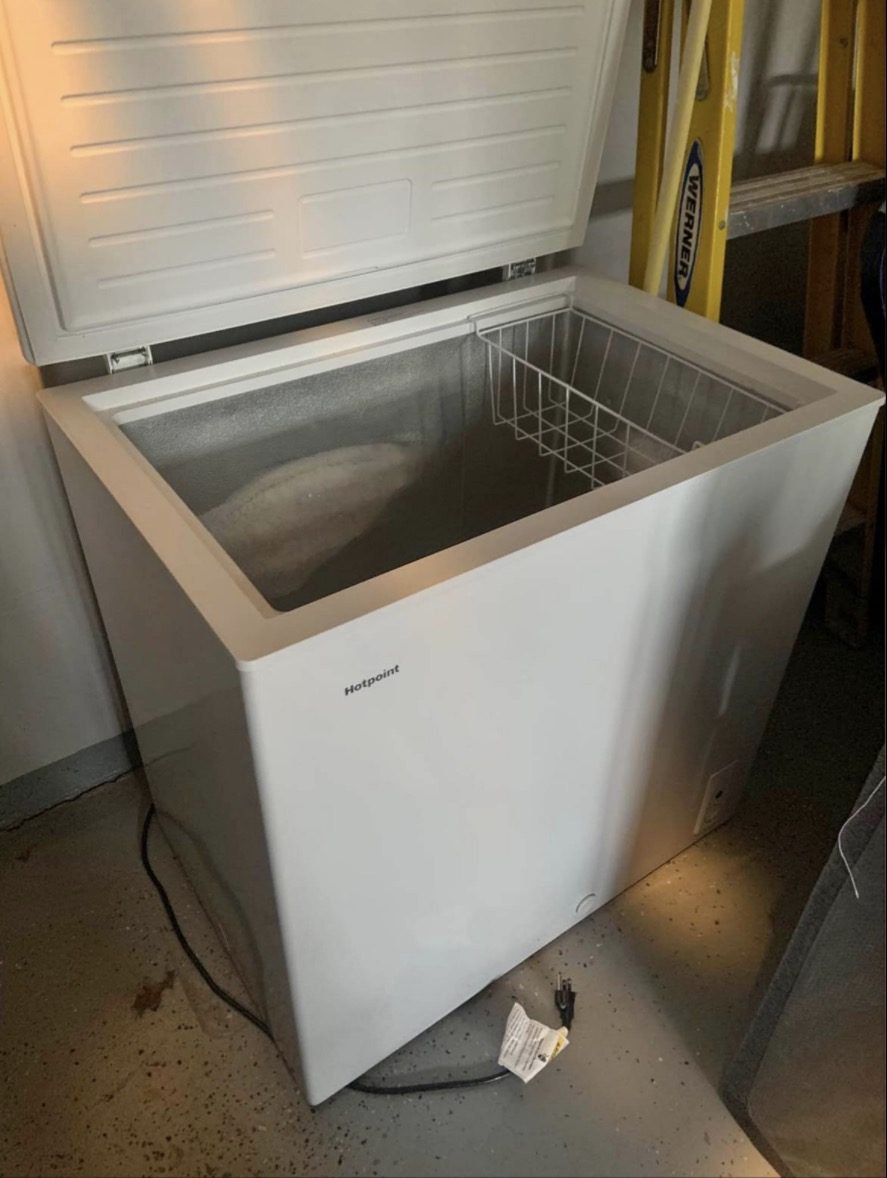 Chest freezer before removal — Leesburg, VA garage