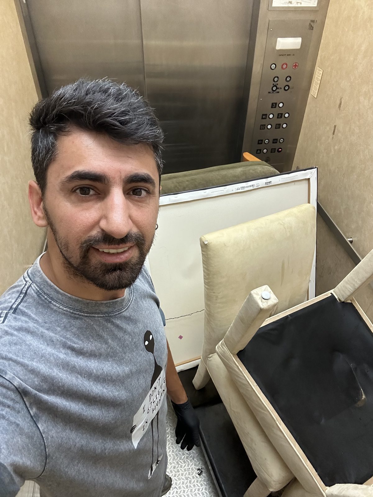 DMV Go Junk owner in freight elevator with furniture — Leesburg storage cleanout