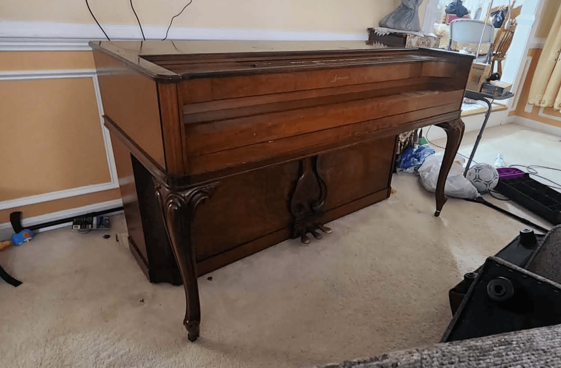 Upright piano before removal — Chevy Chase, MD