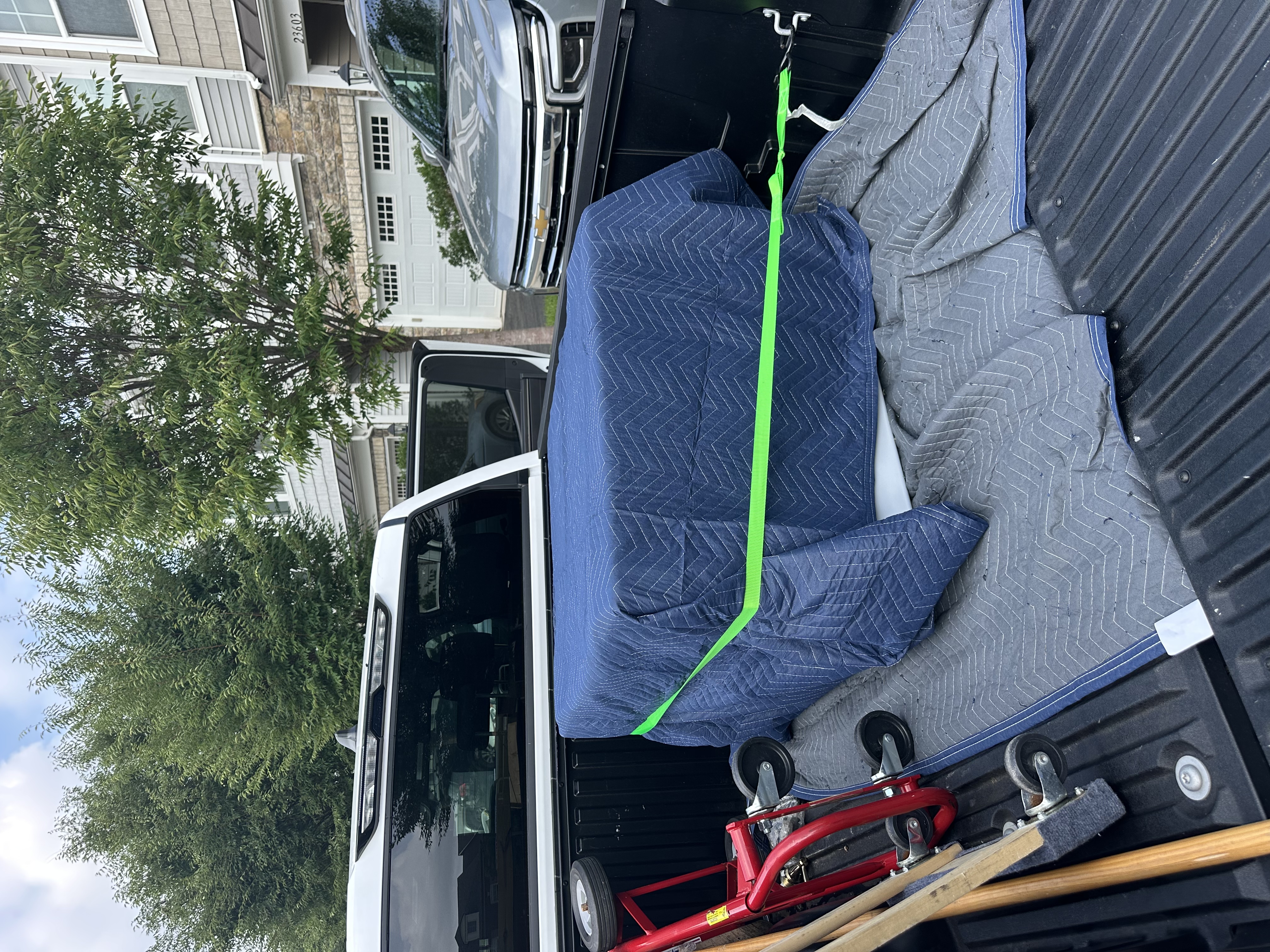 Refrigerator wrapped and strapped for transport — DMV Go Junk Northern Virginia