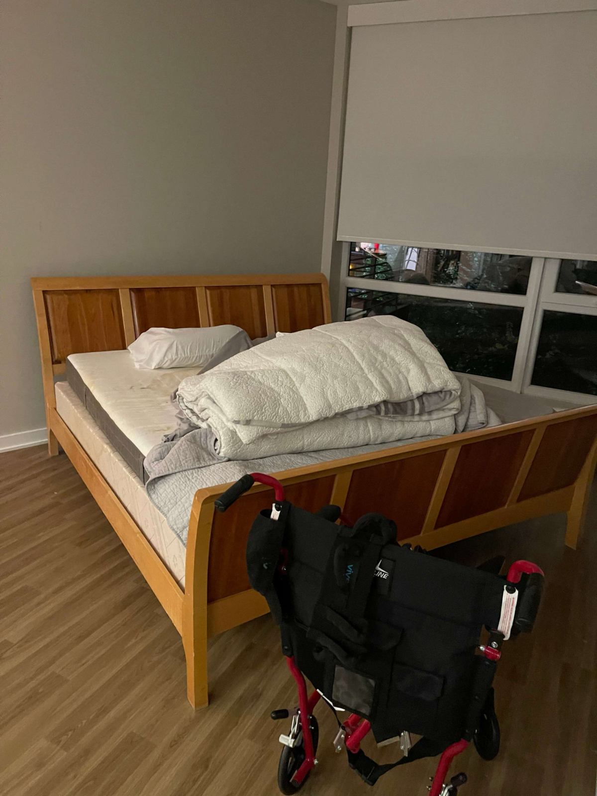 Assisted living room before cleanout, bed and transport chair — Herndon, VA