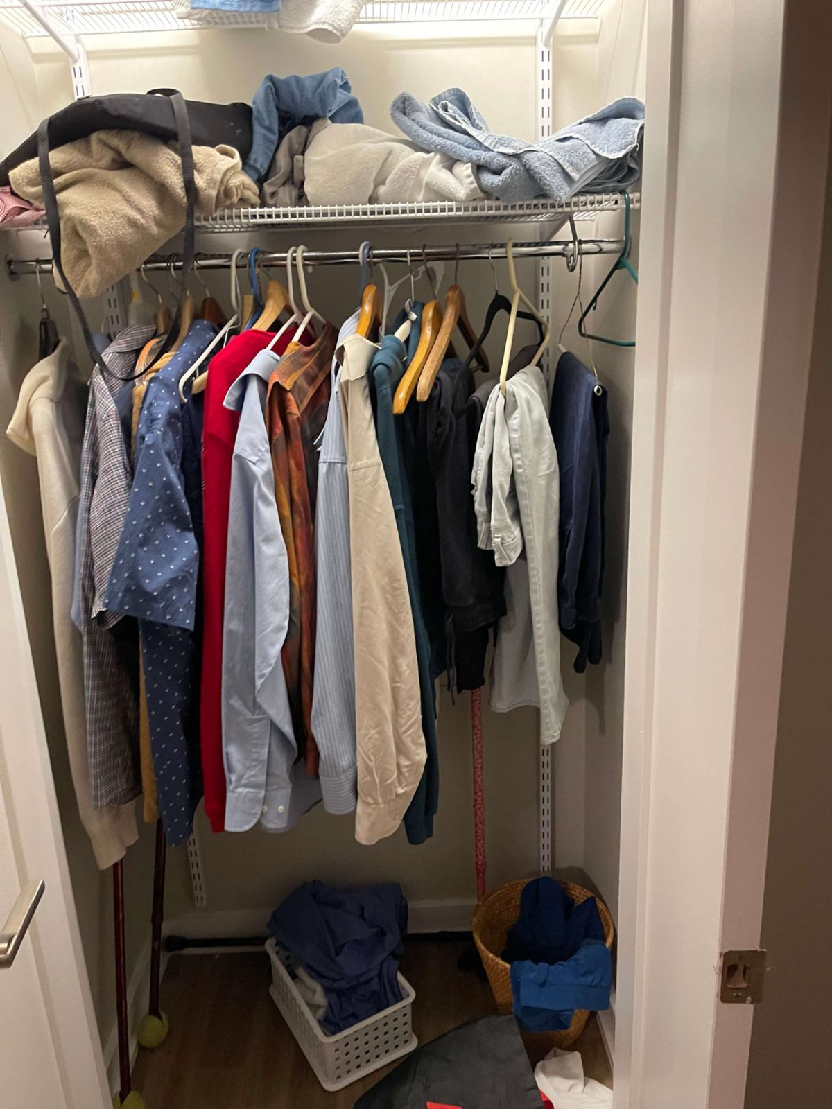 Full closet of clothing before senior living room cleanout — Herndon, VA