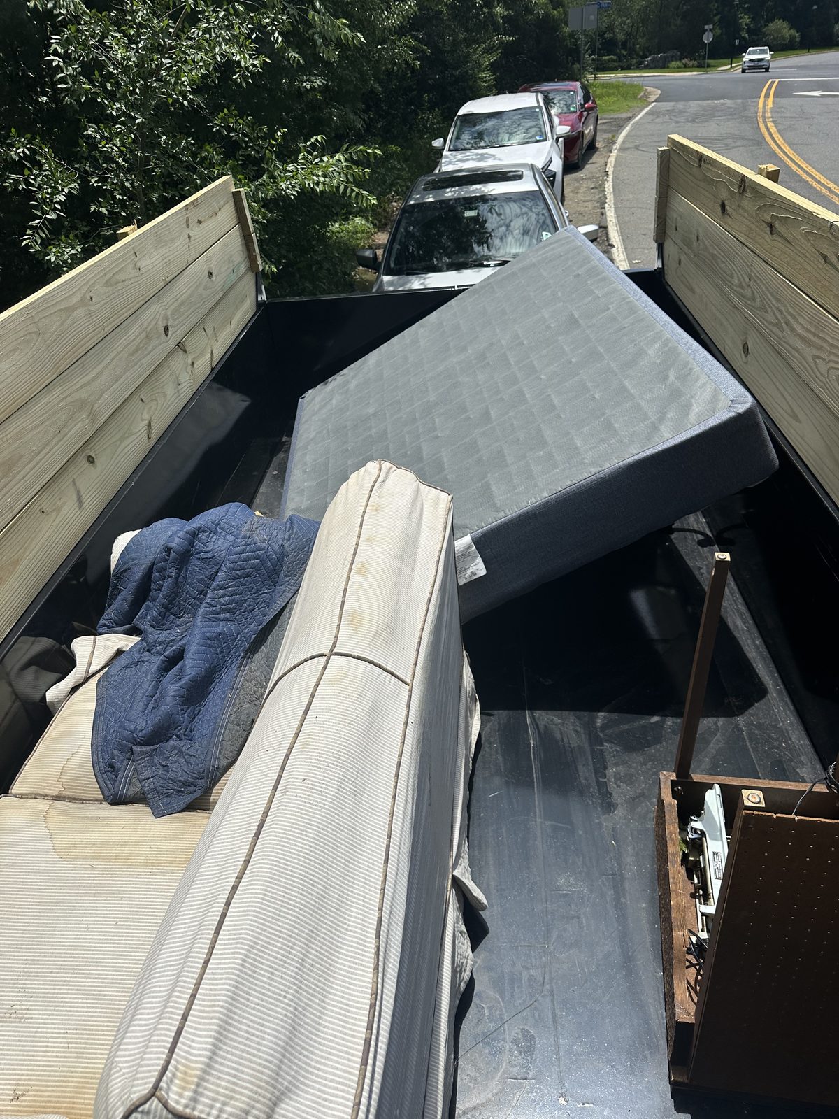 Trailer loaded with furniture and mattress — junk removal Northern Virginia