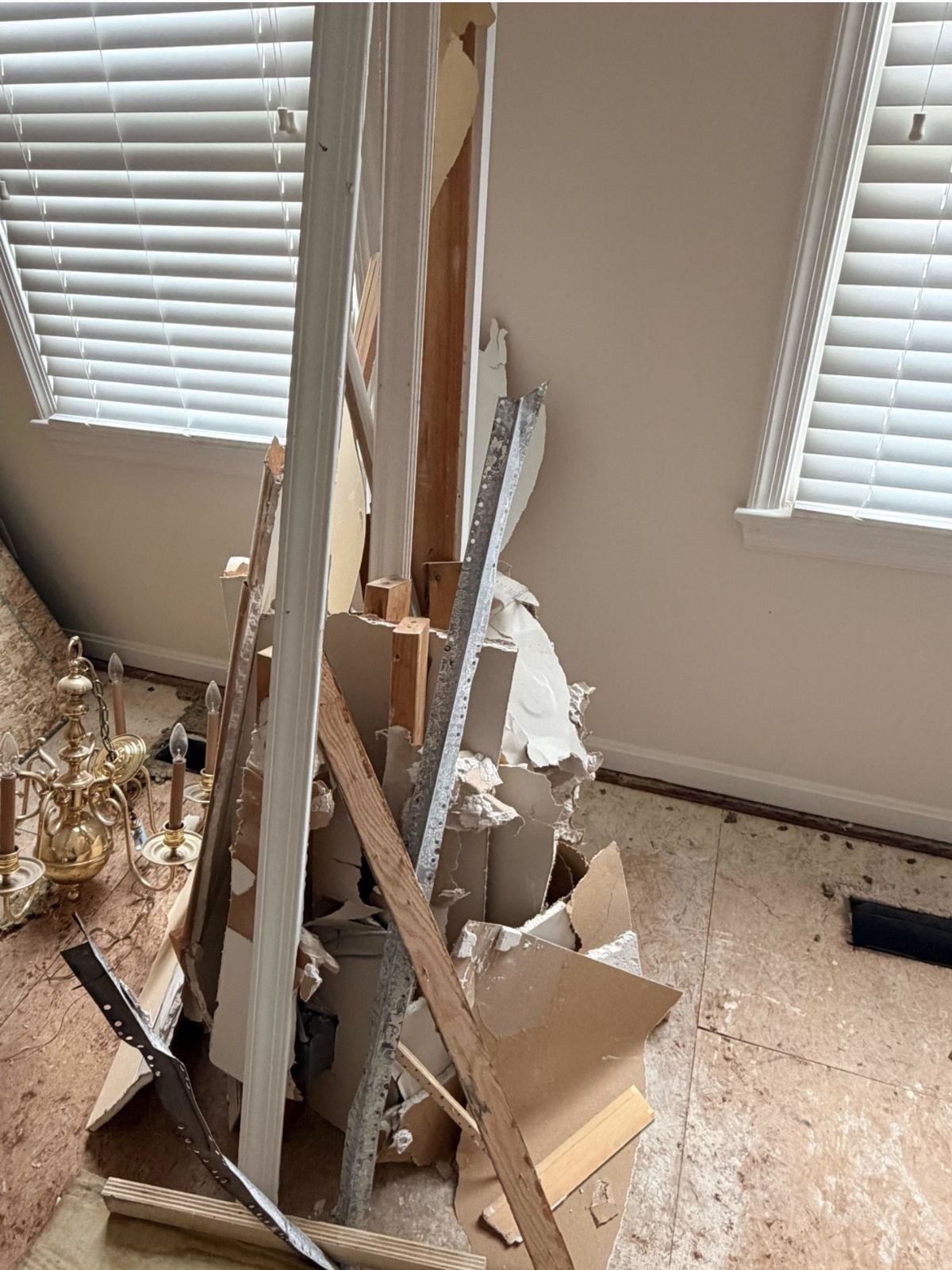 Broken drywall and wall framing debris — Vienna VA renovation