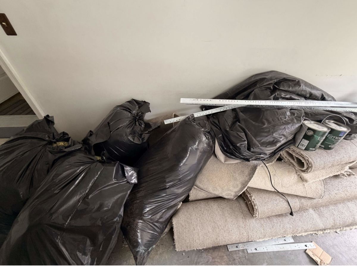 Bagged carpet and construction debris staged before pickup — Vienna VA